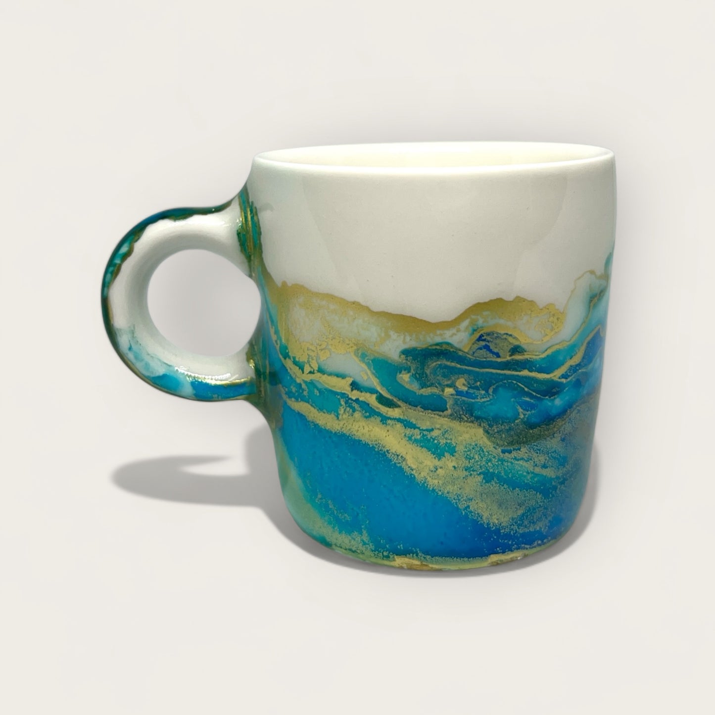 Turquoise green with blue and gold hand-painted espresso cup