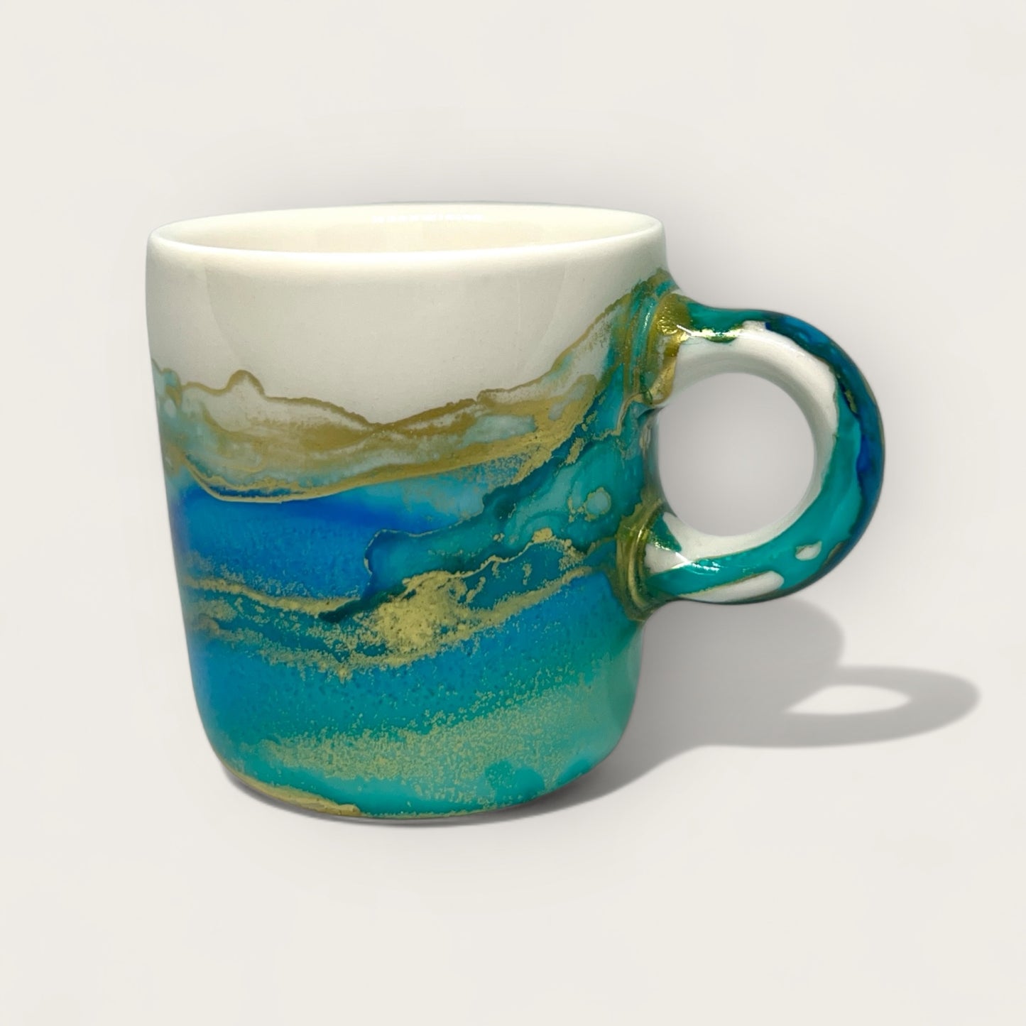 Turquoise green with blue and gold hand-painted espresso cup